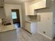 Modern kitchen features white cabinets and granite countertops at 2962 Mcafee Rd, Decatur, GA 30032