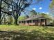 Brick ranch home with a large front yard and mature trees at 2962 Mcafee Rd, Decatur, GA 30032