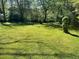 Spacious backyard with lush green grass, providing ample outdoor space at 2962 Mcafee Rd, Decatur, GA 30032