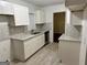 Renovated kitchen, boasting granite counters and white cabinets at 2962 Mcafee Rd, Decatur, GA 30032