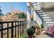 Private balcony with pergola, planters, and wooded views at 4100 Paces Se Walk # 1306, Atlanta, GA 30339
