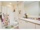 Charming bathroom with a tub shower, updated vanity, and a floral shower curtain at 4100 Paces Se Walk # 1306, Atlanta, GA 30339