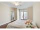 Spacious bedroom with hardwood floors and private balcony access at 4100 Paces Se Walk # 1306, Atlanta, GA 30339