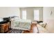 Spacious bedroom with hardwood floors, a queen bed, and a daybed at 4100 Paces Se Walk # 1306, Atlanta, GA 30339