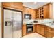 Stainless steel appliances and wood cabinetry in kitchen at 4100 Paces Se Walk # 1306, Atlanta, GA 30339