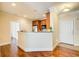 Kitchen with breakfast bar, hardwood floors, and white cabinets at 4100 Paces Se Walk # 1306, Atlanta, GA 30339