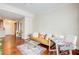 Living room features hardwood floors, a comfy couch, and a convenient workspace at 4100 Paces Se Walk # 1306, Atlanta, GA 30339