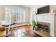 Living room features hardwood floors, fireplace and large windows at 4100 Paces Se Walk # 1306, Atlanta, GA 30339