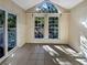 Sunroom with tile flooring and large windows at 219 Cobblestone Trl, Avondale Estates, GA 30002