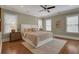 Main bedroom with hardwood floors, neutral walls, and a ceiling fan at 393 Georgia Se Ave, Atlanta, GA 30312