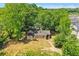 Aerial view of a stone house with a large yard surrounded by trees at 1162 Joseph E Boone Nw Blvd, Atlanta, GA 30314