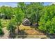 Aerial view of a house with a large lot and surrounding trees at 1162 Joseph E Boone Nw Blvd, Atlanta, GA 30314