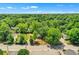Aerial view of a house with a large lot and surrounding trees at 1162 Joseph E Boone Nw Blvd, Atlanta, GA 30314