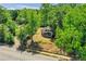 House nestled on a tree-lined street, aerial view at 1162 Joseph E Boone Nw Blvd, Atlanta, GA 30314