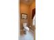 Small half bathroom with tiled floor and window at 187 Eagles Club Dr, Stockbridge, GA 30281