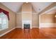 Spacious living room featuring hardwood floors and a fireplace at 187 Eagles Club Dr, Stockbridge, GA 30281