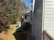 Two-story house with deck and screened porch, side view at 358 Lake Forest Ct, Lawrenceville, GA 30043