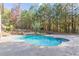 Stunning pool with a waterfall feature and stone landscaping at 512 Cooper Lake Se Rd, Mableton, GA 30126