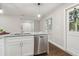 Modern kitchen features stainless steel appliances and white shaker cabinets at 2349 Springdale Sw Rd, Atlanta, GA 30315