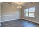 Formal dining room featuring hardwood floors and large windows at 730 Cams Crk, Mcdonough, GA 30253