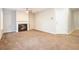 Living room with fireplace and ceiling fan, offering a cozy atmosphere at 2686 Silver Queen Rd, Ellenwood, GA 30294