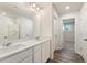 Double vanity bathroom with a walk-in shower and linen closet at 4187 Viola Pl, Atlanta, GA 30349