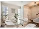 Dining area with glass table and white chairs at 6424 Woodstone Way, Morrow, GA 30260