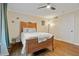 Bedroom with hardwood floors, ceiling fan, and built-in closet at 869 Briarcliff Ne Rd # B20, Atlanta, GA 30306