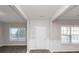 Bright entryway with white wainscoting and hardwood floors at 909 Galloway Ct, Mcdonough, GA 30253