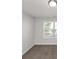 Bright bedroom with neutral carpeting and large window at 909 Galloway Ct, Mcdonough, GA 30253