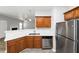 Kitchen with stainless steel appliances and light wood cabinets at 909 Galloway Ct, Mcdonough, GA 30253