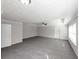 Spacious bedroom with large window and carpet at 909 Galloway Ct, Mcdonough, GA 30253