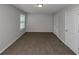 Well lit bedroom with neutral carpeting and double closets at 909 Galloway Ct, Mcdonough, GA 30253