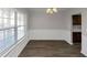 Spacious dining room with hardwood floors and built-in shelving at 909 Galloway Ct, Mcdonough, GA 30253