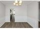Dining room with hardwood floors and view into kitchen at 909 Galloway Ct, Mcdonough, GA 30253