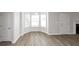 Living room with hardwood floors and bay window at 909 Galloway Ct, Mcdonough, GA 30253