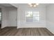Dining room with hardwood floors and wainscoting, near entryway at 909 Galloway Ct, Mcdonough, GA 30253