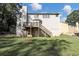 Two story house exterior with deck and fenced backyard at 909 Galloway Ct, Mcdonough, GA 30253