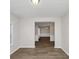 Bright dining room features hardwood floors and wainscoting at 909 Galloway Ct, Mcdonough, GA 30253