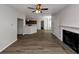 Open living room with hardwood floors, fireplace, and kitchen views at 909 Galloway Ct, Mcdonough, GA 30253