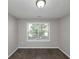 Bright bedroom with neutral carpeting and large window at 909 Galloway Ct, Mcdonough, GA 30253