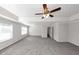 Large bedroom with ceiling fan and carpet at 909 Galloway Ct, Mcdonough, GA 30253