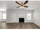 Living room with hardwood floors and ceiling fan at 909 Galloway Ct, Mcdonough, GA 30253
