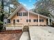 Exterior of charming light pink house with deck at 4405 Cary Dr, Snellville, GA 30039