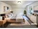 Virtually staged main bedroom with a king-size bed and ample natural light at 4405 Cary Dr, Snellville, GA 30039