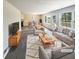 Virtually staged living room with gray couches and coffee table at 4405 Cary Dr, Snellville, GA 30039