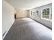 Spacious living room with large windows and gray carpet at 4405 Cary Dr, Snellville, GA 30039