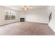 Large living room with a cozy fireplace and neutral carpeting at 4910 Rapahoe Trl, Atlanta, GA 30349