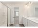 Double vanity bathroom with a large shower and adjacent bedroom access at 4171 Viola Pl, Atlanta, GA 30349