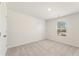 Spacious bedroom with carpeted floor, window with blinds, and neutral walls at 4171 Viola Pl, Atlanta, GA 30349